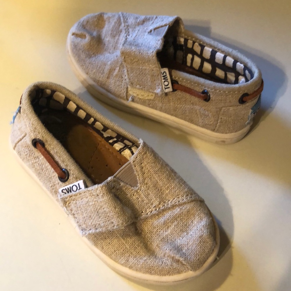 Khaki colored toms brand shoes